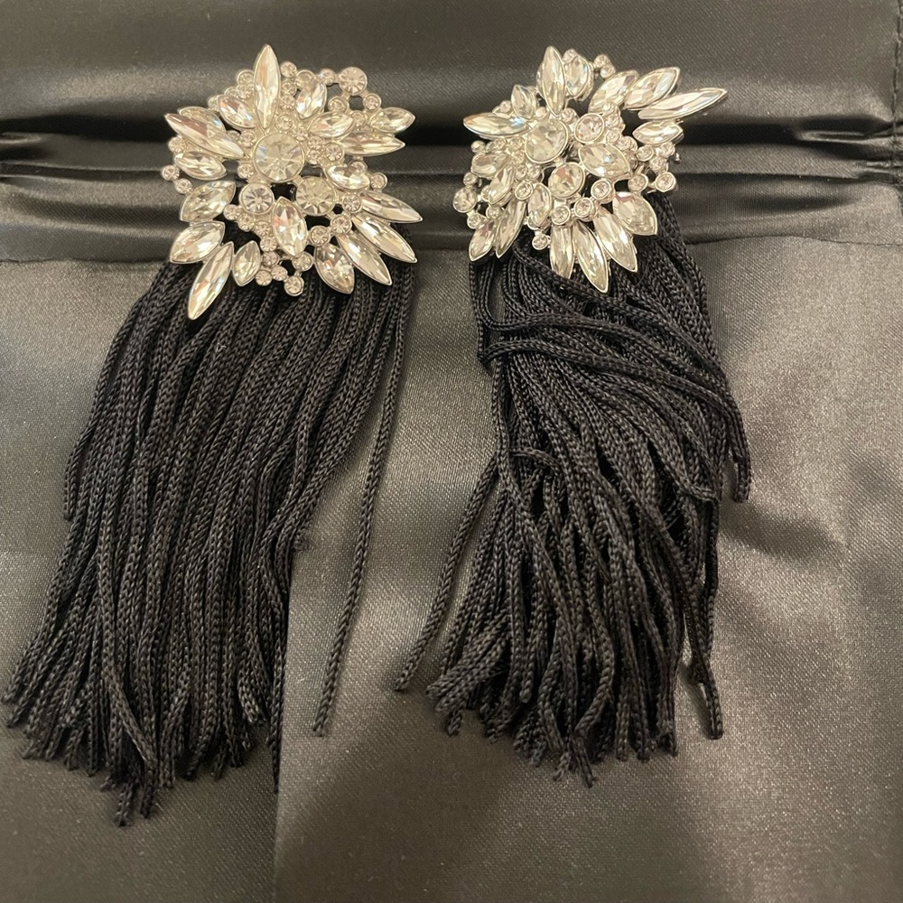 Statement earrings with black fringe. Stud earring back.